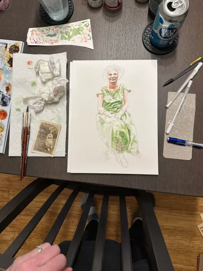 A watercolor portrait part-way through painting